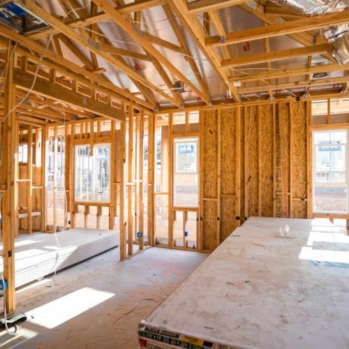 New home construction with wooden framing and natural light.