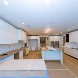 Kitchen cabinet installation in progress at Pacific Luxury Services Inc.